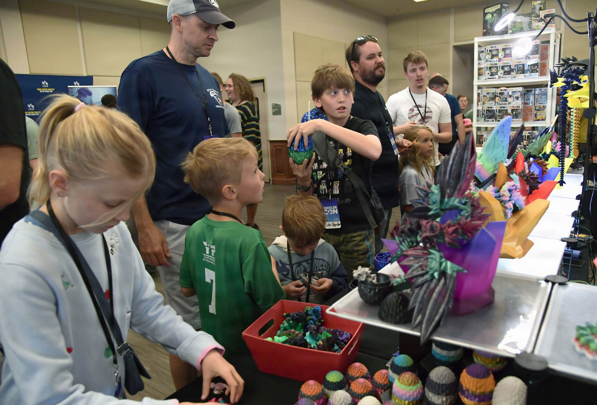 A group of people review toy dragons