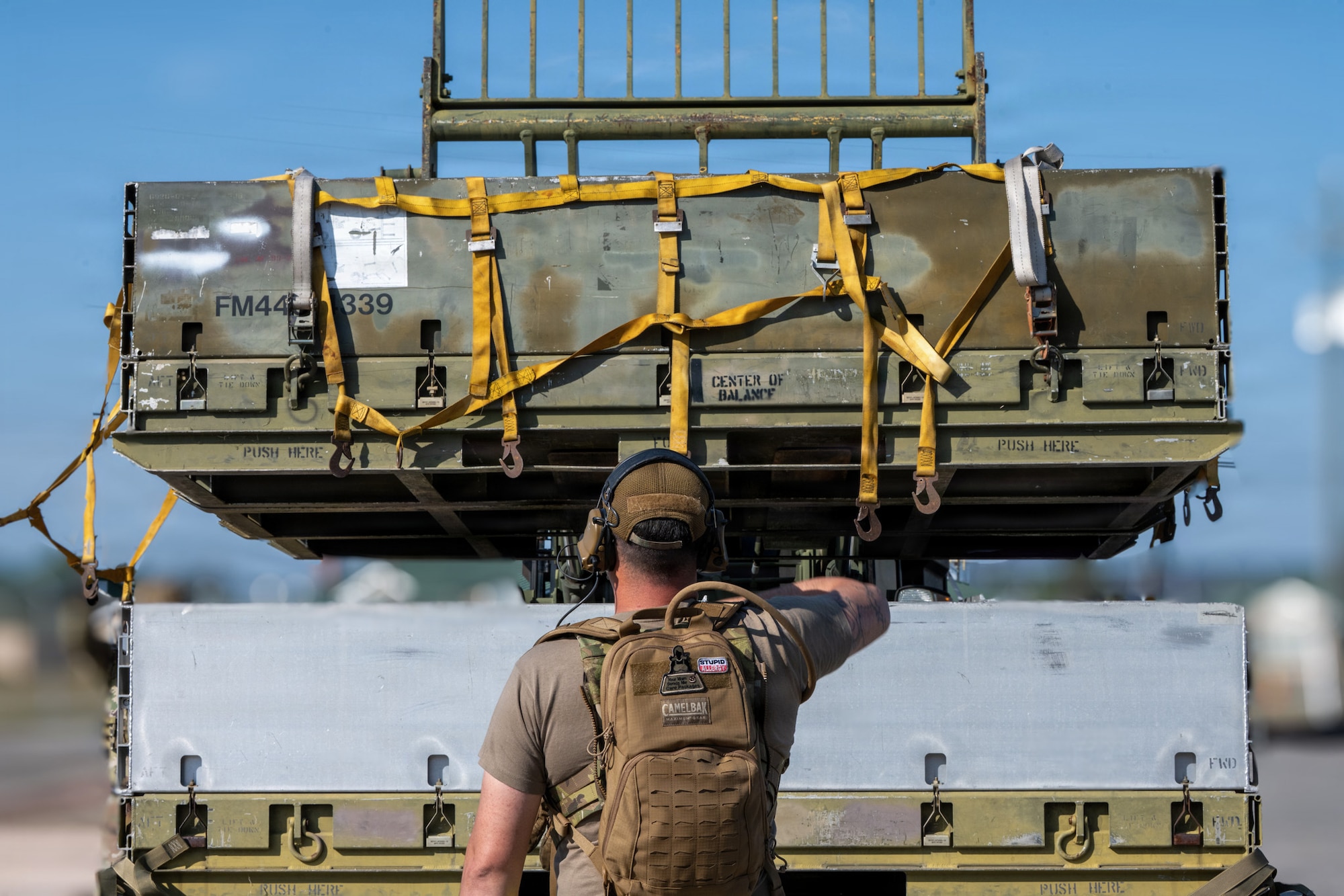 A U.S. Air Force aerial port Airman, known as “Port Dawgs,” prepares cargo for transport at Savannah Air National Guard Base, Georgia, April 23, 2026, during Exercise Ready Tiger 26-3. The exercise advanced integrated operations across multiple units, testing logistics support to deliver combat power when and where it was needed.  (U.S. Air Force photo by Staff Sgt. Sari Seibert)