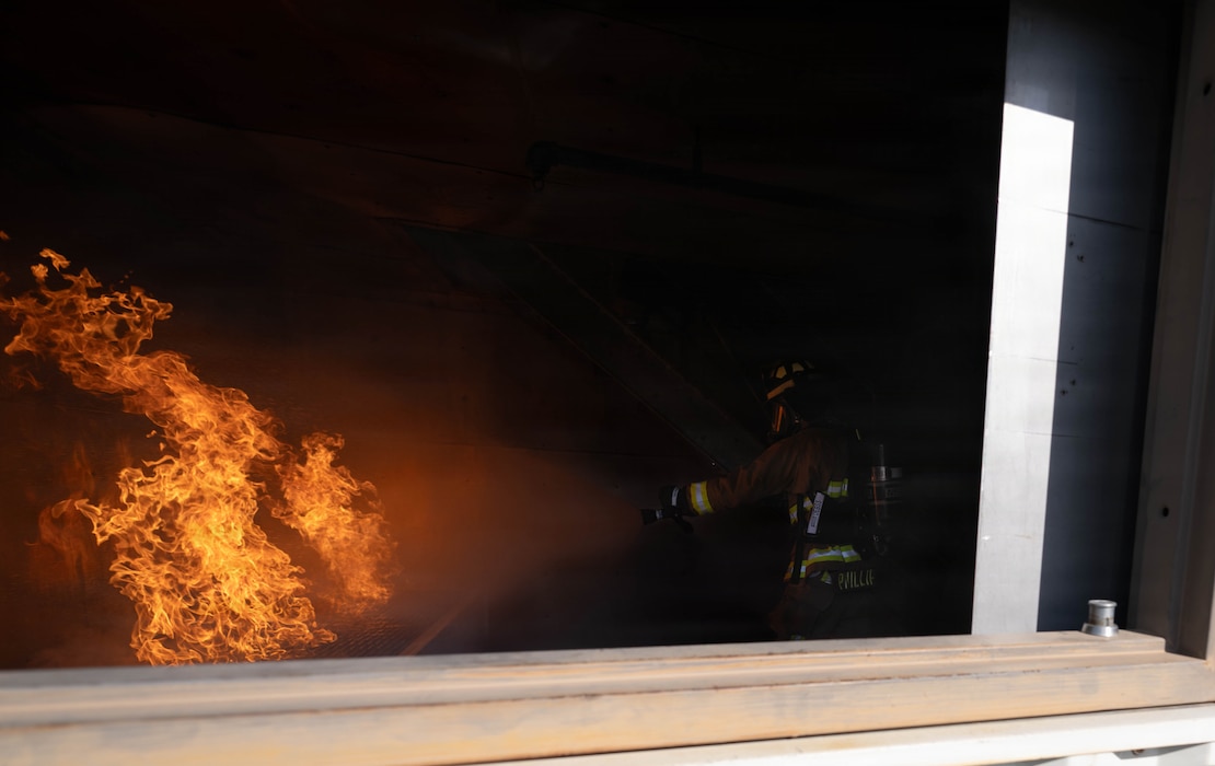A U.S. Air Force Airman assigned to the 23d Combat Air Base Squadron puts out a controlled fire during Exercise Ready Tiger 26-3 at Savannah Air National Guard Base, Georgia, April 15, 2026. Controlled fire training allowed Airmen to build proficiency and confidence, ensuring safe and effective response to structural fires. High-tempo scenarios validated the wing’s ability to generate forces and sustain operations under pressure. (U.S. Air Force photo by Senior Airman Victoria Moehlman)