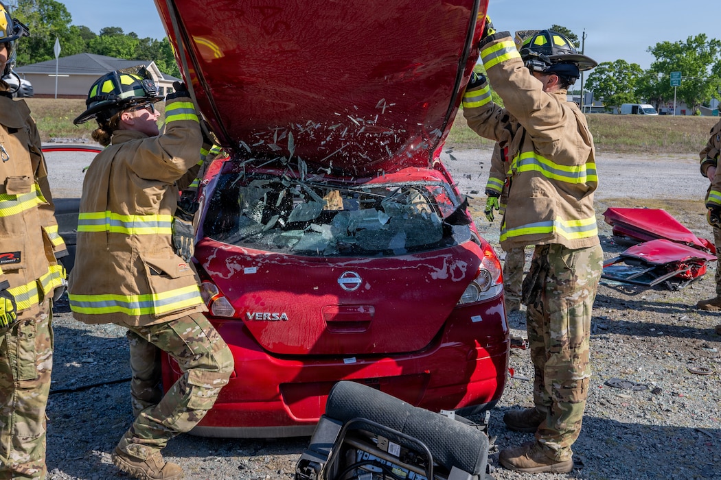 U.S. Air Force Airmen assigned to the 23d Combat Air Base Squadron remove a car roof during a fire training exercise during Exercise Ready Tiger 26-3 at Savannah Air National Guard Base, Georgia, April 16, 2026.  Airmen executed mission-essential tasks in a joint environment to sustain a lethal, ready force aligned with Air Combat Command priorities. (U.S. Air Force Photo by Senior Airman Iain Stanley)