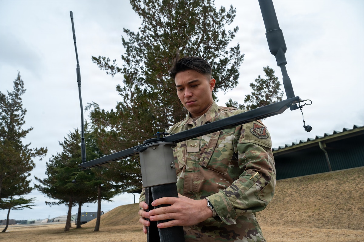 U.S. Air Force Airman 1st Class Tyler Soriano, 610th Air Control Flight (ACF) battle management technician, demonstrates a mobile data link field deployment at Misawa Air Base.