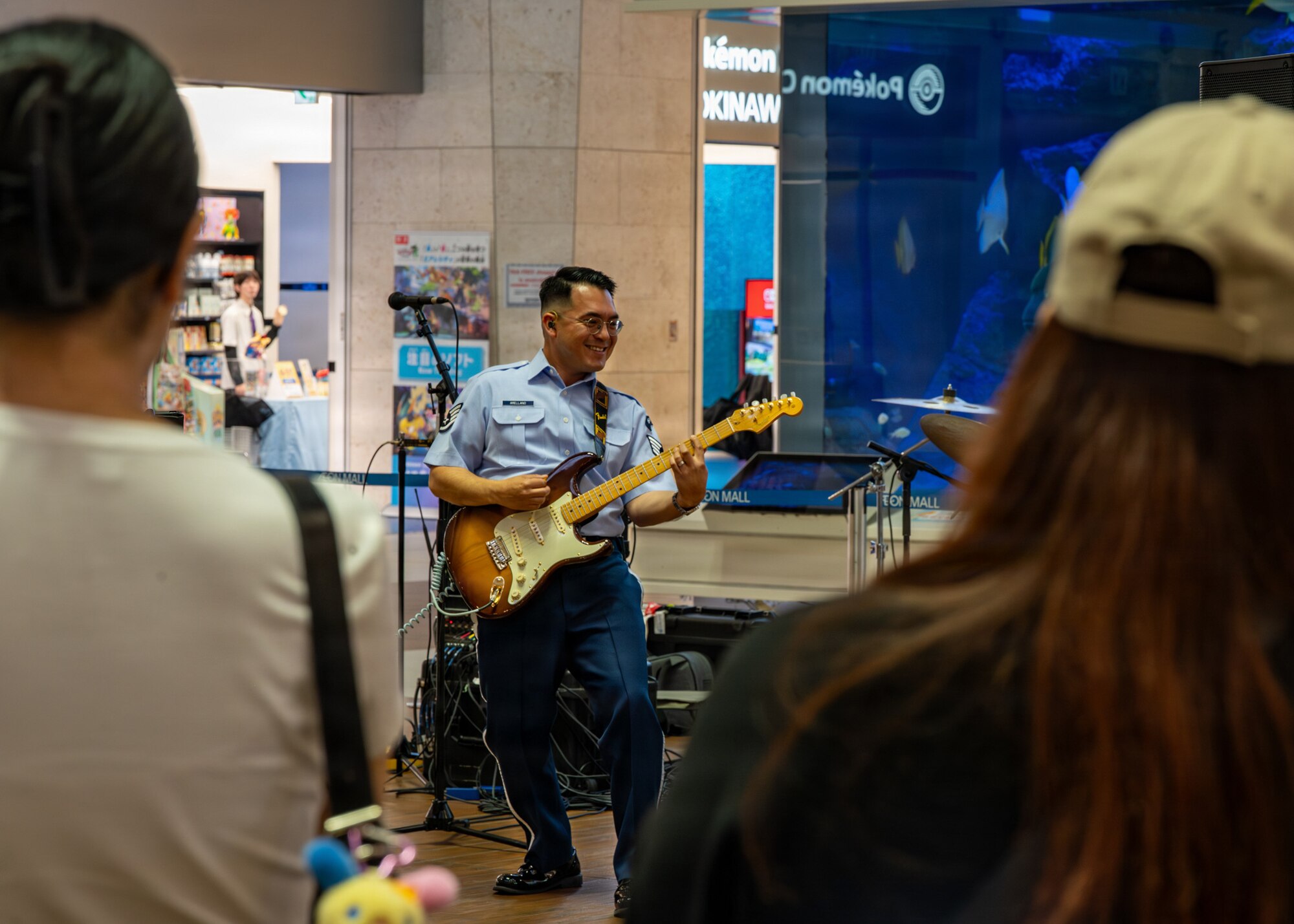 U.S. Air Force Staff Sgt. Christopher Arellano, U.S. Air Force Band of the Pacific guitarist, plays the guitar during a performance at a local mall in Kitanakagusuku, Okinawa, April 13, 2026.