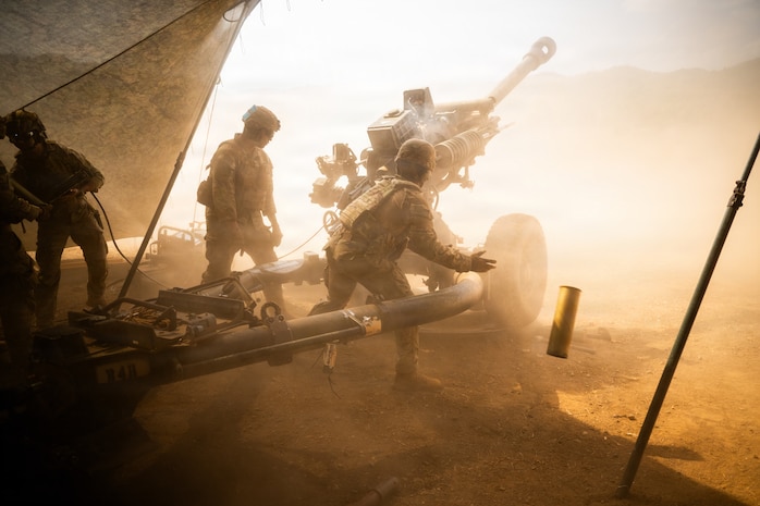 A U.S. Soldier, artillery crew member assigned to 3rd Battalion, 7th Field Artillery Regiment, 25th Infantry Division, extracts an expended 105mm shell casing during exercise Salaknib 26 at Fort Magsaysay Combat Readiness Training Area, Canantong, Nueva Ecija, Philippines, April 17, 2026.