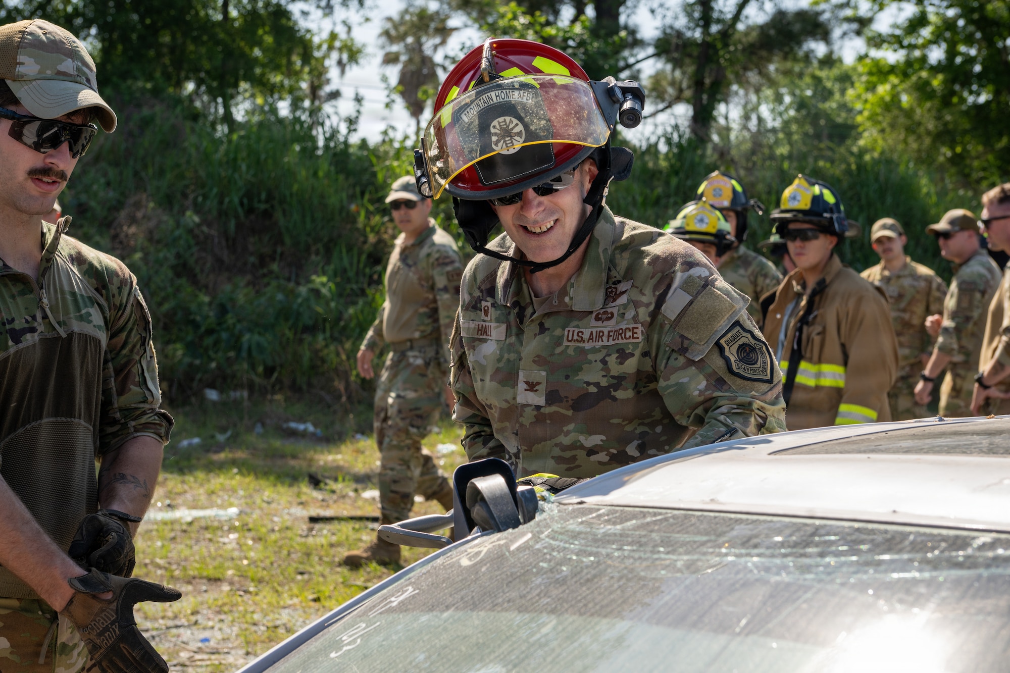 U.S. Air Force Col. Sean Hall, 23d Wing commander, uses a hydraulic rescue tool during a firefighter training event at Exercise Ready Tiger 26-3 at Savannah Air National Guard Base, Georgia, April 16, 2026. During final stages of the exercise, Hall toured the area to experience how his Airmen execute mission-essential tasks to sustain a lethal, ready force aligned with Air Combat Command priorities. (U.S. Air Force Photo by Senior Airman Iain Stanley)