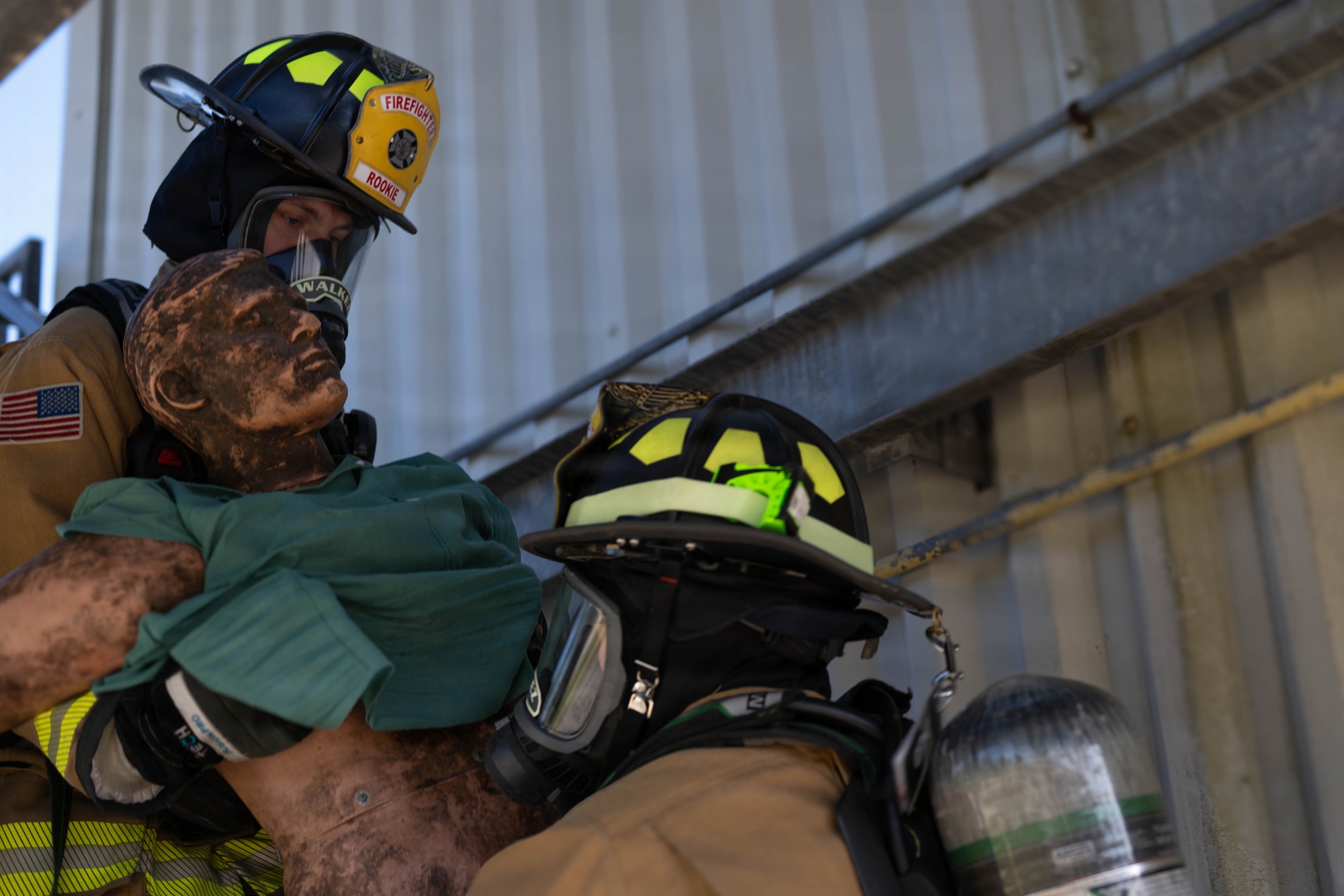 U.S. Air Force Airmen assigned to the 23d Combat Air Base Squadron carry a training dummy to safety from controlled structure fire during Exercise Ready Tiger 26-3 at Savannah Air National Guard Base, Georgia, April 15, 2026. Rescue training prepared firefighters to locate and evacuate victims, minimizing risk and supporting mission continuity. High-tempo scenarios validated the wing’s ability to generate forces and sustain operations under pressure. (U.S. Air Force photo by Senior Airman Victoria Moehlman)
