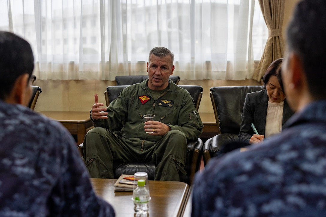 U.S. Marine Corps Brig. Gen. Simon Doran, center, the commanding general of 1st Marine Aircraft Wing, and a native of Liverpool, England, speaks with Japan Maritime Self-Defense Force Rear Admiral Katasuhi Ohkubo, the commander of Fleet Air Wing 31, during a base tour on Marine Corps Air Station Iwakuni, Japan, April 17, 2026. Brig. Gen. Doran visited MCAS Iwakuni to speak with leaders about unit capabilities and strengthening command relationships. (U.S. Marine Corps Photo by Cpl. Dahkareo Pritchett)