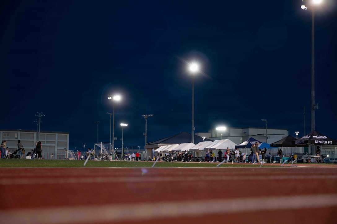 U.S. Marines, Sailors, and Marine Corps Air Station Iwakuni community members participate in the 2026 You Are Not Alone 24-hour Walk at MCAS Iwakuni, Japan, April 16, 2026. Marine Aircraft Group 12 invited MCAS Iwakuni personnel to participate in this 24-hour walk to bring attention to Sexual Assault Awareness and Prevention month. (U.S. Marine Corps photo by Lance Cpl. Tyler Bassett)