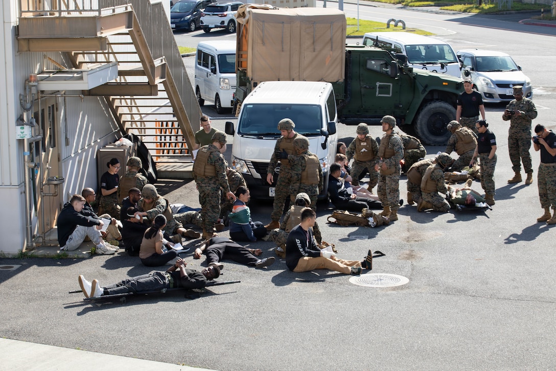U.S. Navy Sailors with 3rd Dental Battalion, 3rd Marine Logistics Group triage simulated casualties for a simulated casualty evacuation during Shika-X at Marine Corps Air Station Iwakuni, Japan, April 16, 2026. Shika-X is an annual exercise that evaluates a corpsman’s proficiency in Tactical Combat Casualty Care while managing mass casualty scenarios. (U.S. Marine Corps photo by Sgt. Peter Rawlins)