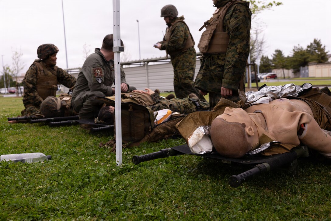 U.S. Sailors with 3rd Dental Battalion, 3rd Marine Logistics Group, conduct a simulated mass casualty training during exercise Shika-X 26 at Marine Corps Air Station Iwakuni, Japan, April 15, 2026. Shika-X is an annual exercise that evaluates a corpsman’s proficiency in tactical combat casualty care while managing mass casualty scenarios. (U.S. Marine Corps photo by Cpl. Ella Cadby)