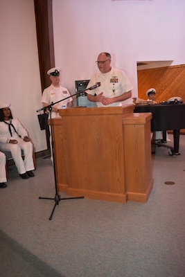 Master Chief Brandon Lindbeck shares his parting thoughts with the audience during a ceremony held in his honor as he prepares to hang up the uniform and head for deeper waters.