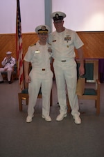 Capt. Christopher Barnes and HMCM Brandon Lindbeck share a moment before the close of the ceremony.