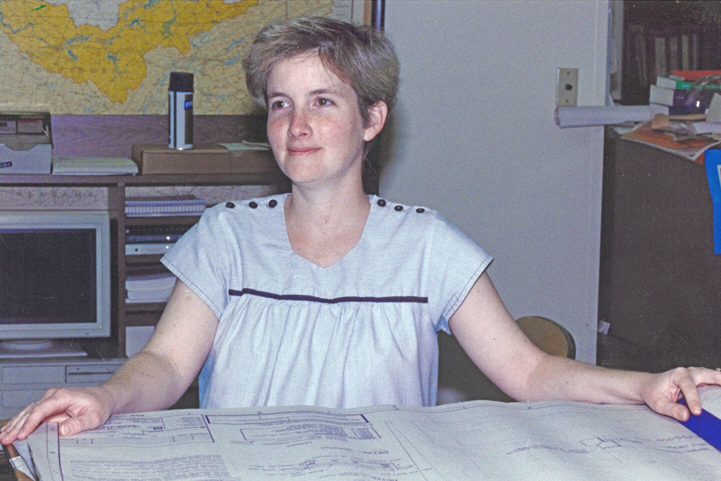 Connie Flatt reviews a project blueprint July 7, 1986, at the U.S. Army Corps of Engineers Nashville District Headquarters in Nashville, Tennessee. She recently culminated 46 years of federal service during a retirement ceremony March 31, 2026. (USACE Photo)