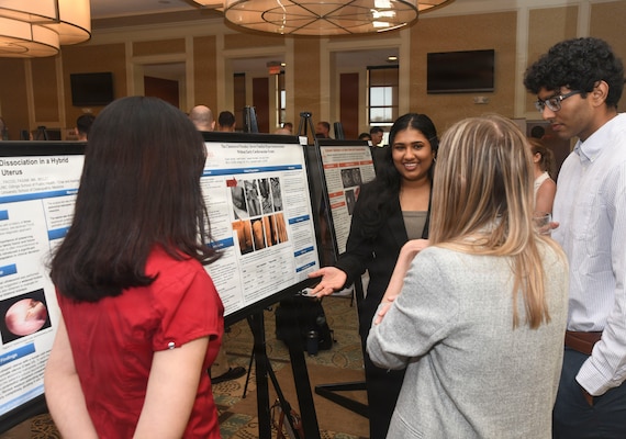 Attendees discuss research projects and their findings during Naval Medical Center Camp Lejeune’s Annual Research Symposium on April 16, 2026. The event, in its 16th year, showcases academic endeavors of medical and dental personnel, both military and civilian throughout Eastern and Coastal North Carolina.