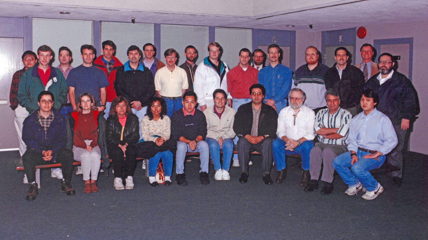 Connie Flatt (Front Row, Second from Left), poses with coworkers March 15, 1996, at the Nashville District Headquarters in Nashville, Tennessee. She recently culminated 46 years of federal service during a retirement ceremony March 31, 2026. (USACE Photo)