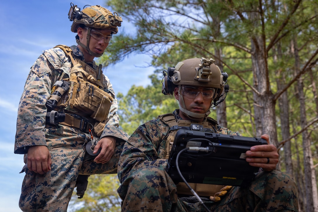 U.S. Marine Corps Staff Sgt. Jackie Tran, left, and Sgt. Aviel Solomon, both explosive ordnance disposal technicians with Combat Logistics Battalion 2, Combat Logistics Regiment 2, 2nd Marine Logistics Group, review the x-ray scan of a simulated ordnance threat during the EOD Team of the Year competition at Marine Corps Base Camp Lejeune, North Carolina, April 13, 2026. The service level competition was hosted by 8th ESB for more than 50 Marines to test individual and team skills in realistic scenarios and share tactics, techniques and procedures, with the winning team being recognized by the Congressional EOD Caucus. Tran is a native of California. Solomon is a native of Pennsylvania. (U.S. Marine Corps photo by Sgt. Rafael Brambila-Pelayo)