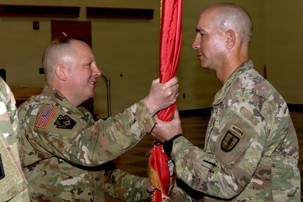 U.S. Army National Guard Soldiers, leaders and family members attend a change of command ceremony for the 166th Regiment – Regional Training Institute at Fort Indiantown Gap, Pennsylvania April 17, 2026. During the ceremony, Col. John Wenzel relinquished command to Lt. Col. Max Furman, symbolizing the transfer of authority within the organization. The 166th Regiment trains more than 5,000 Soldiers annually and serves as a premier Regional Training Institute within the Army National Guard. (U.S. Army National Guard photo by Sgt. 1st Class Shane Smith)