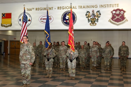 U.S. Army National Guard Soldiers, leaders and family members attend a change of command ceremony for the 166th Regiment – Regional Training Institute at Fort Indiantown Gap, Pennsylvania April 17, 2026. During the ceremony, Col. John Wenzel relinquished command to Lt. Col. Max Furman, symbolizing the transfer of authority within the organization. The 166th Regiment trains more than 5,000 Soldiers annually and serves as a premier Regional Training Institute within the Army National Guard. (U.S. Army National Guard photo by Sgt. 1st Class Shane Smith)
