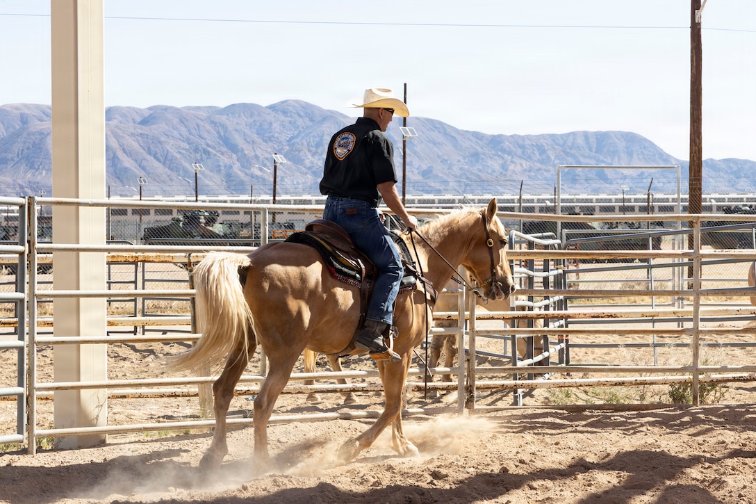 U.S. Marine Corps Col. Russell Savatt, the commanding officer of Marine Corps Logistics Base Barstow, rides Sunny at MCLB Barstow, Calif., April 15, 2026. The Marine Corps Mounted Color Guard, the only remaining Marine Corps equestrian unit, is stationed at MCLB Barstow, where it trains and cares for its horses while supporting ceremonies and public events. (U.S. Marine Corps photo by Sgt. Davin Tenbusch)