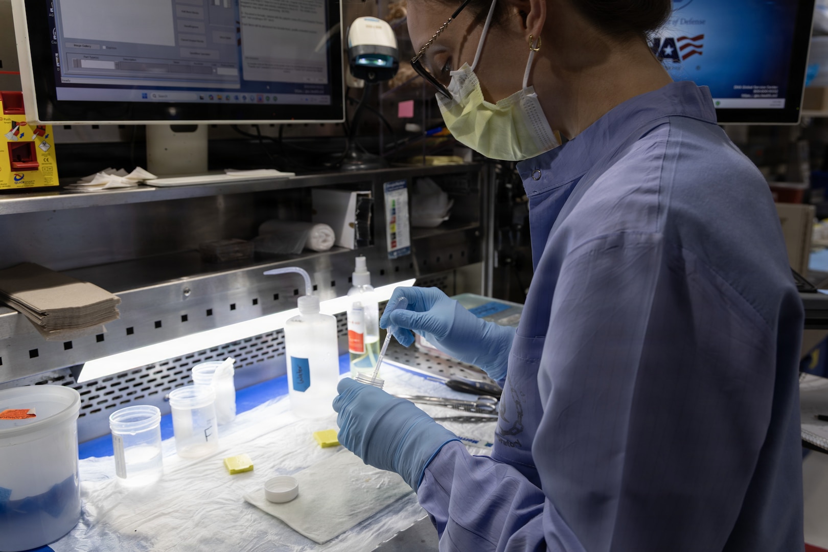 Pottenburg is processing a specimen in the laboratory.