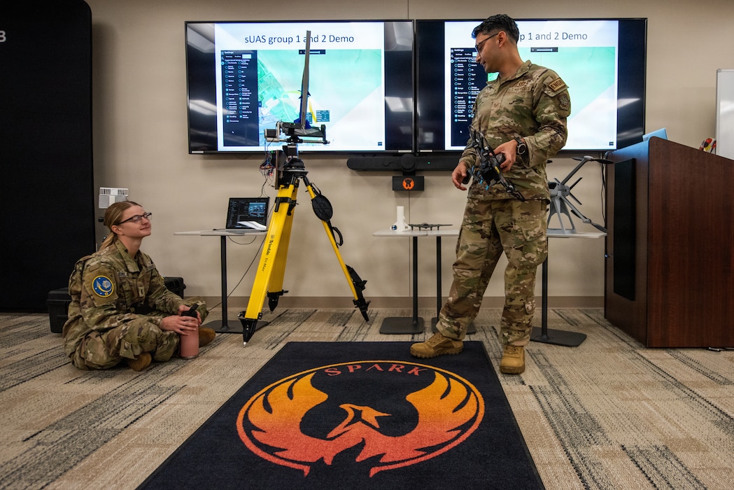 Presenters pitch an idea during event.