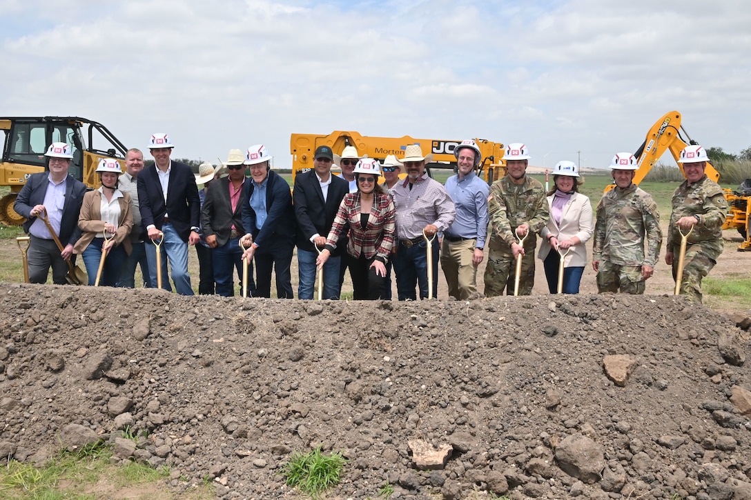 A groundbreaking ceremony was held on April 17, 2026, at Moore Air Base for the New World Screwworm Sterile Fly Production Facility. Once complete and fully operational, the facility will produce approximately 300 million sterile flies per week. Pictured from right to left in helmets are U.S. Army Corps of Engineers’ Fort Worth District Commander Col. Calvin Kroeger, USACE Southwestern Division Commander Brig. Gen. George Walter, Mortenston Vice President and General Manager Kelly McNamara, USACE Commander Lt. Gen. William “Butch” Graham Jr., Principal Deputy Assistant Secretary for the Army for Installations, Energy and Environment Dr. Jeff Waksman, U.S. Department of the Agriculture Secretary Brooke Rollins, Senator John Cornyn, Under Secretary of Agriculture for Marketing and Regulatory Programs Mr. Dudley Hoskins, USDA Animal and Plant Health Inspection Service Acting Administrator Kelly Moore, and USDA Deputy Director for New World Screwworm Directorate Chris Needham. Others in the photo are members of the USDA’s Veterinary Services “Tick Riders”.