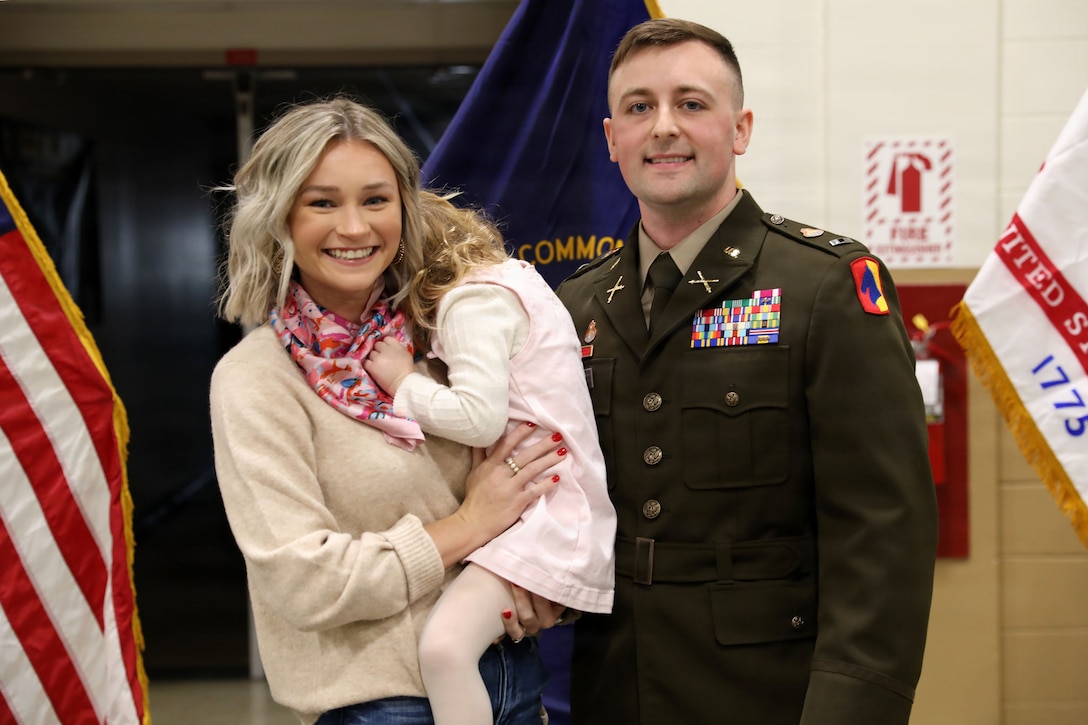 U.S. Army Warrant Officer Elijah Johnson with his wife, Samijo, and daughter, Mallory after his appointment, Feb. 10, 2026, in Lexington, Kentucky.