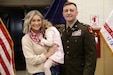 U.S. Army Warrant Officer Elijah Johnson with his wife, Samijo, and daughter, Mallory after his appointment, Feb. 10, 2026, in Lexington, Kentucky. Johnson is Kentucky’s newest field artillery targeting technician, assigned to the 138th Operational Fires Command. (U.S. Army National Guard photo by Sgt. 1st Class Benjamin Crane)