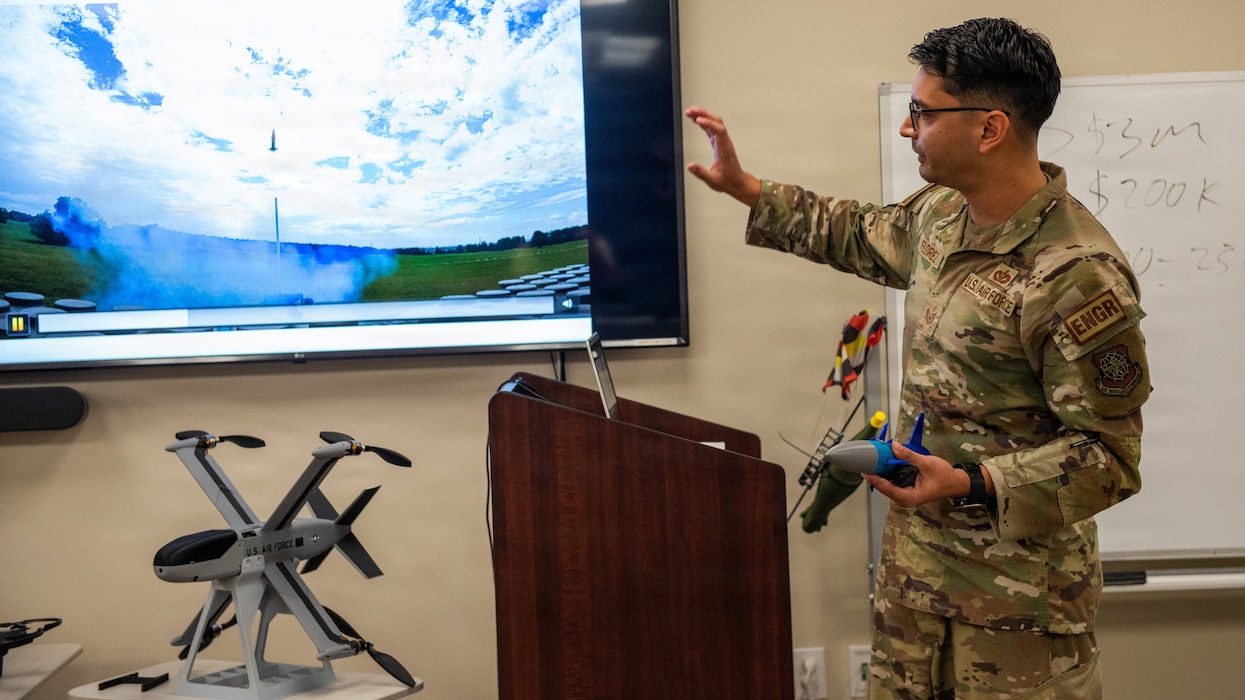 Presenter pitches an idea to judges not pictured