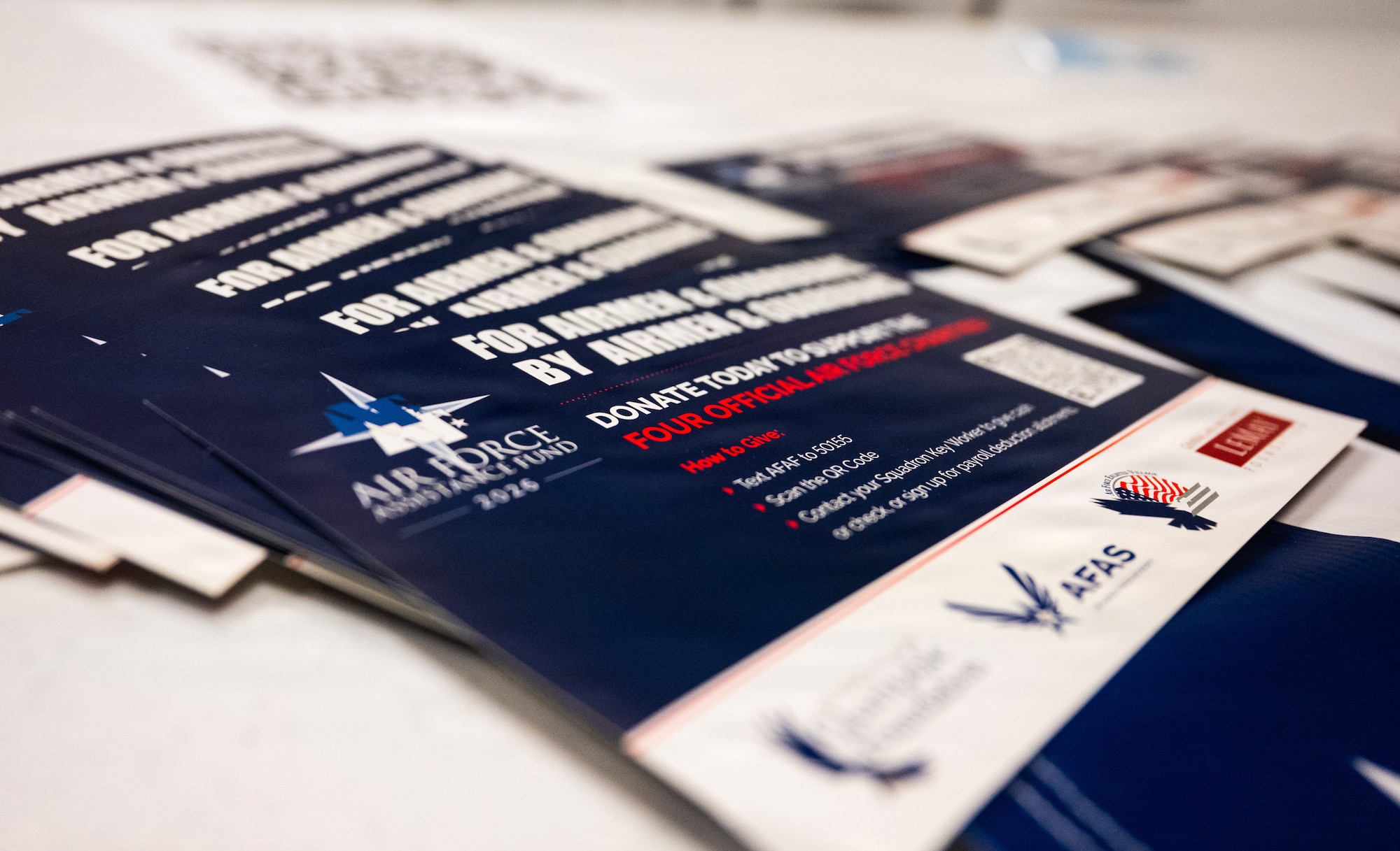 blue and white information flyer sit on a white table