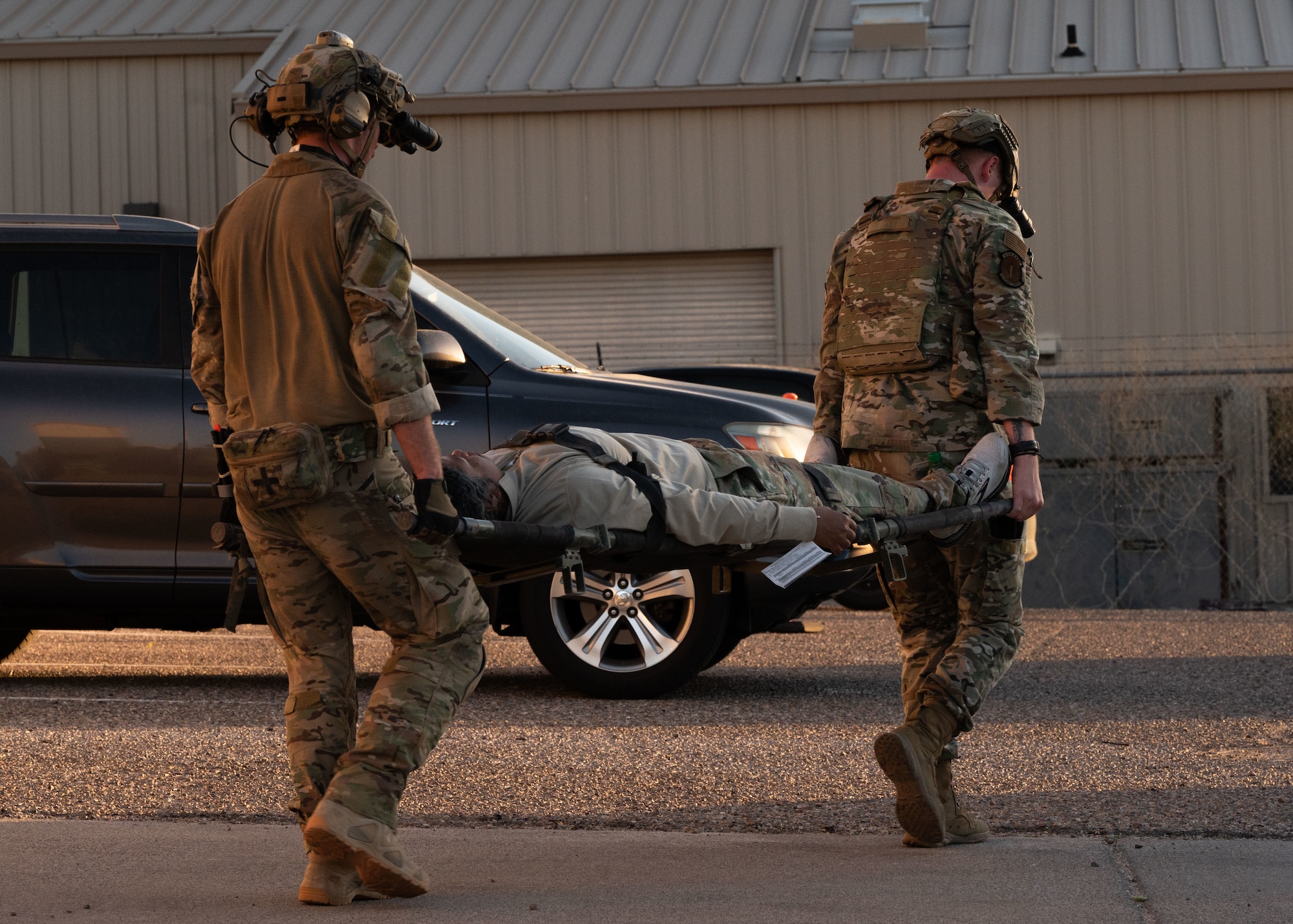 Two U.S. Air Force Pararescuemen assigned to the 68th Rescue Squadron carry a simulated casualty from an extraction point during the Combat Leader Course at Davis-Monthan Air Force Base, Arizona,  April 17, 2026. Pararescuemen are required to use a combination of leadership skills while in a high-stress environment in order to ensure mission success. (U.S. Air Force by Airman Najzee Kuzu)