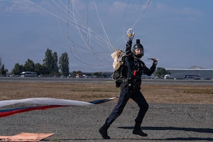 U.S. Air Force Lt. Col. Tripp Johnson, Wings of Blue commander, lands following a parachute demonstration during Feria Internacional del Aire y del Espacio (FIDAE) in Santiago, Chile, April 11, 2026. The demonstration underscores the professionalism and precision of U.S. Air Force personnel while supporting international engagement through aerial demonstration and outreach. (U.S. Air Force photo by Andrea Jenkins)