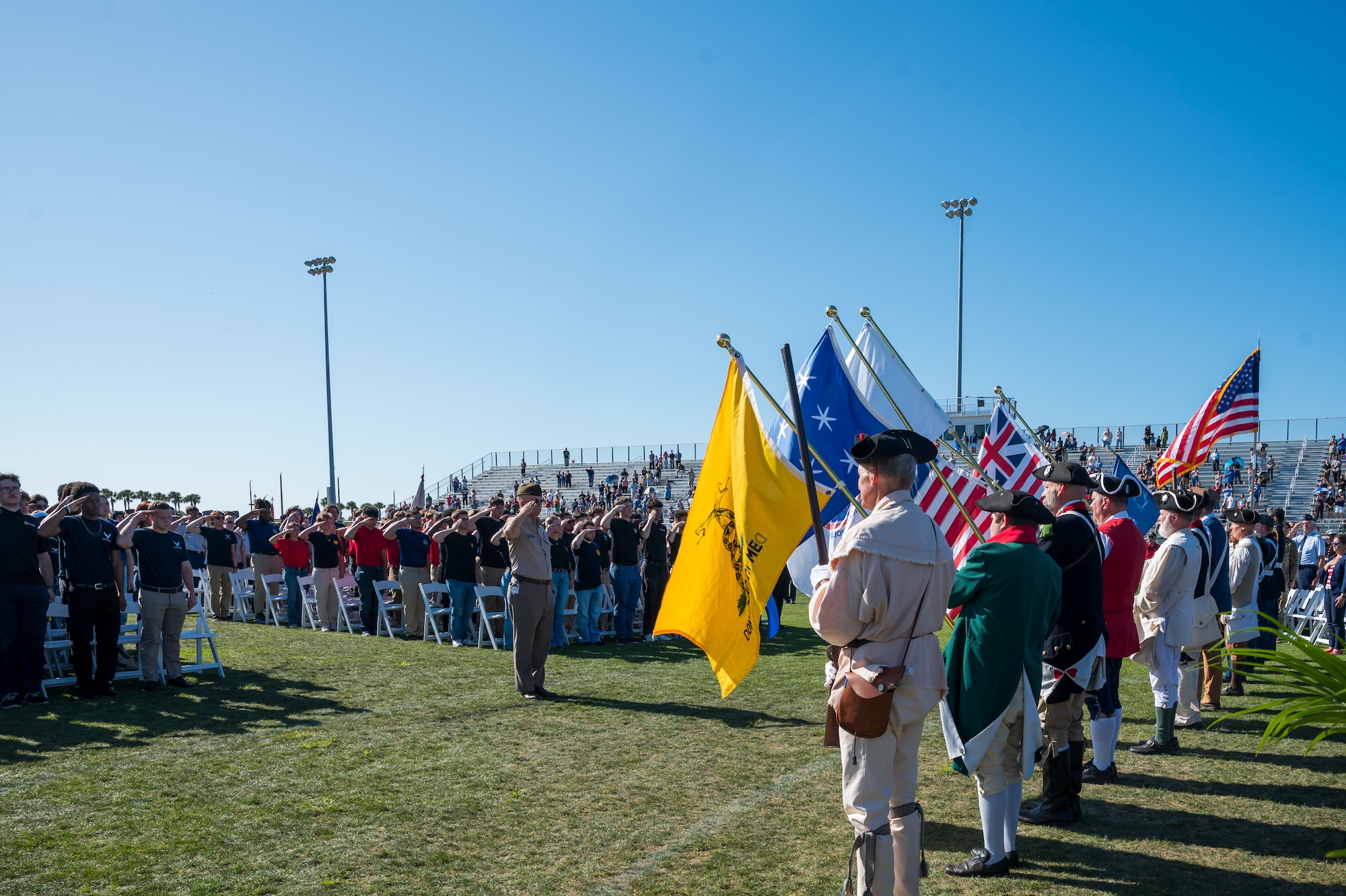 Attendees pause for the National Anthem during the 2026 Enlistment of the Space Coast Ceremony at Viera High School in Melbourne, Fla., April 17, 2026. Nearly 250 enlistees officially committed to serve in the U.S. military during the ceremony, which brought together families, educators and community leaders from across Brevard County. (U.S. Space Force photo by Gwendolyn Kurzen)