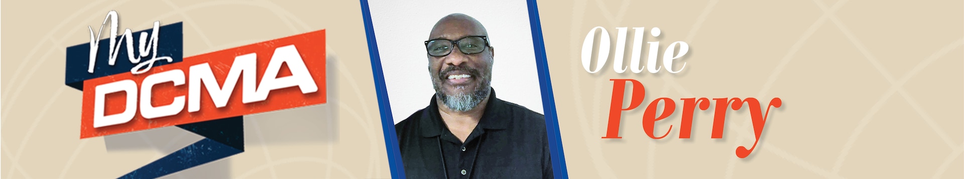 Smiling man with a beard wears glasses and a black shirt