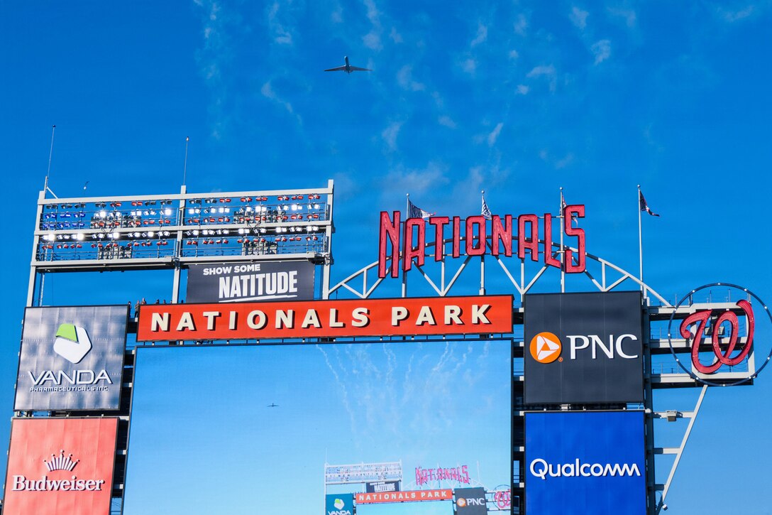 Nationals stadium big screen in frame as a fly over is conducted.