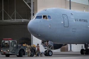 Team McConnell Airmen stow chocks from a KC-46A Pegasus during a weather evacuation on the flightline at McConnell Air Force Base, Kansas, April 17, 2026. In response to forecasted severe weather, maintenance and aircrew teams relocated aircraft to minimize potential damage. These efforts highlight the wing’s commitment to protecting resources and maintaining mission readiness in dynamic conditions. (U.S. Air Force photo by Senior Airman Paula Arce)