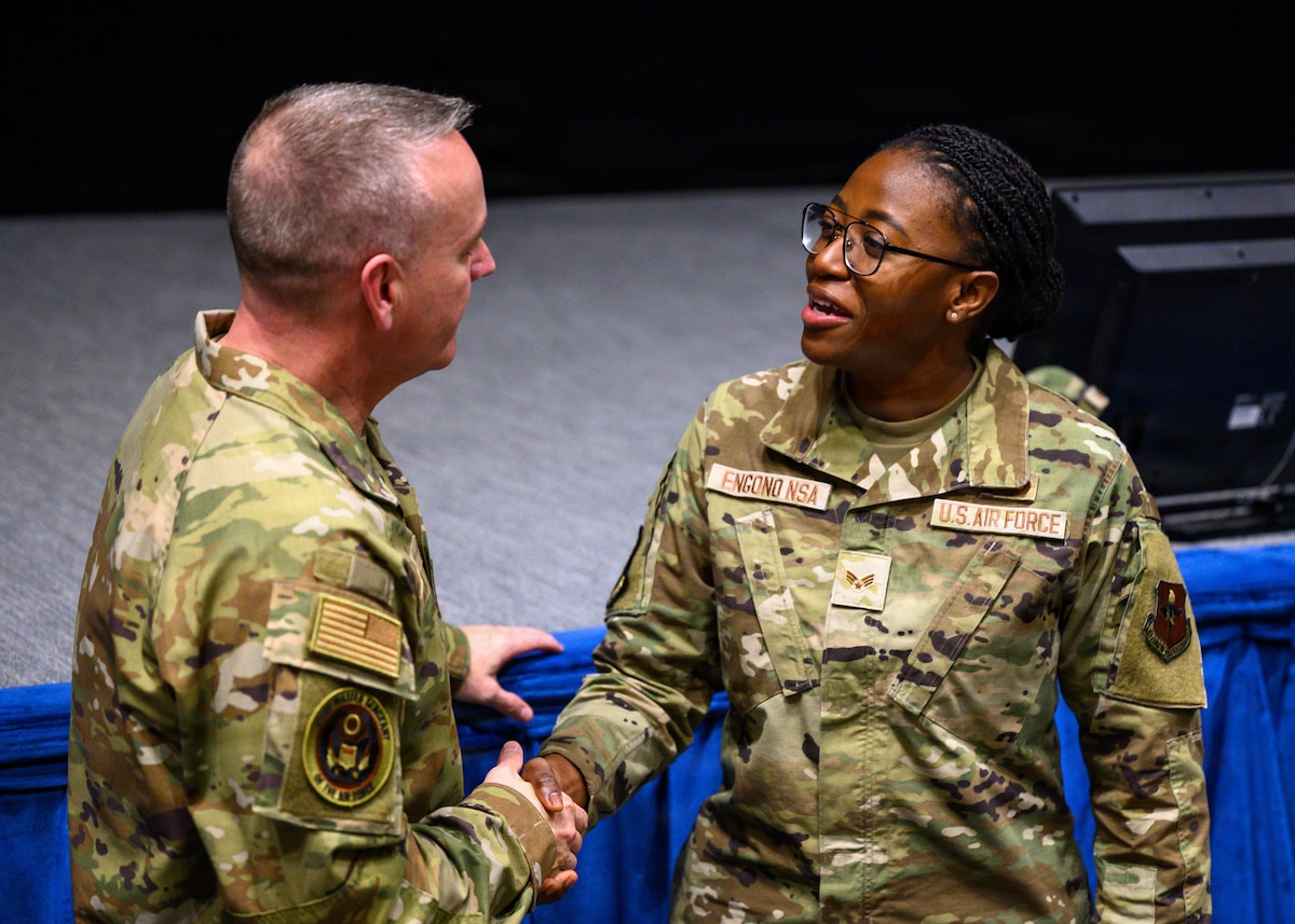 Senior Airman Maria Engono, 42d Logistics Readiness Squadron Deployment and Distribution flight, meets Chief Master Sgt. of the Air Force David Wolfe after an all call at Maxwell Air Force Base, Alabama, April 14, 2026