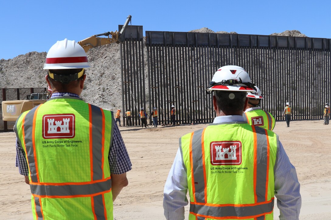 U.S. Army Corps of Engineers South Pacific Border Task Force installs the final border barrier panel at the Barry M. Goldwater Range, or BMGR-1, project site April 15 near Yuma, Arizona. USACE is replacing permanent border barriers along the southern border of the U.S. at the direction of the U.S. Army by the Secretary of War, in response to the presidential national emergency declaration dated Jan. 20, 2025, authorizing the use of Section 2803 of Title 10, U.S. Code.