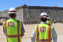 U.S. Army Corps of Engineers South Pacific Border Task Force installs the final border barrier panel at the Barry M. Goldwater Range, or BMGR-1, project site April 15 near Yuma, Arizona. USACE is replacing permanent border barriers along the southern border of the U.S. at the direction of the U.S. Army by the Secretary of War, in response to the presidential national emergency declaration dated Jan. 20, 2025, authorizing the use of Section 2803 of Title 10, U.S. Code.