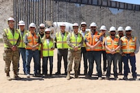 U.S. Army Corps of Engineers South Pacific Border Task Force installs the final border barrier panel at the Barry M. Goldwater Range, or BMGR-1, project site April 15 near Yuma, Arizona. USACE is replacing permanent border barriers along the southern border of the U.S. at the direction of the U.S. Army by the Secretary of War, in response to the presidential national emergency declaration dated Jan. 20, 2025, authorizing the use of Section 2803 of Title 10, U.S. Code.