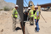 U.S. Army Corps of Engineers South Pacific Border Task Force installs the final border barrier panel at the Barry M. Goldwater Range, or BMGR-1, project site April 15 near Yuma, Arizona. USACE is replacing permanent border barriers along the southern border of the U.S. at the direction of the U.S. Army by the Secretary of War, in response to the presidential national emergency declaration dated Jan. 20, 2025, authorizing the use of Section 2803 of Title 10, U.S. Code.
