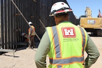 U.S. Army Corps of Engineers South Pacific Border Task Force installs the final border barrier panel at the Barry M. Goldwater Range, or BMGR-1, project site April 15 near Yuma, Arizona. USACE is replacing permanent border barriers along the southern border of the U.S. at the direction of the U.S. Army by the Secretary of War, in response to the presidential national emergency declaration dated Jan. 20, 2025, authorizing the use of Section 2803 of Title 10, U.S. Code.