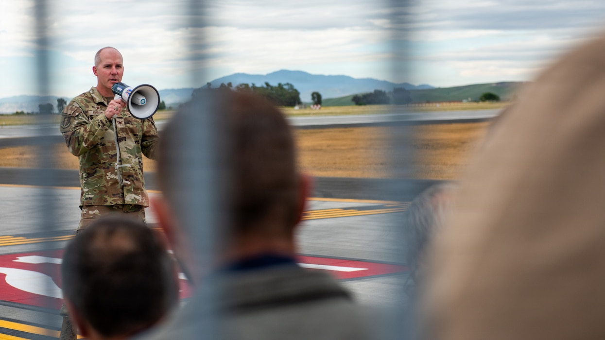 Wing commander delivers remarks during ribbon cutting ceremony