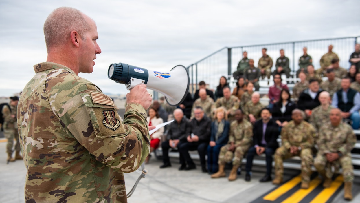 Wing commander delivers remarks during ribbon cutting ceremony
