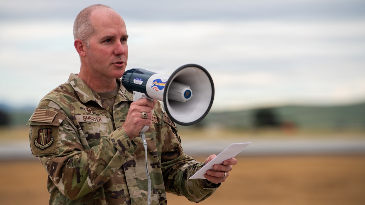 Wing commander delivers remarks during ribbon cutting ceremony
