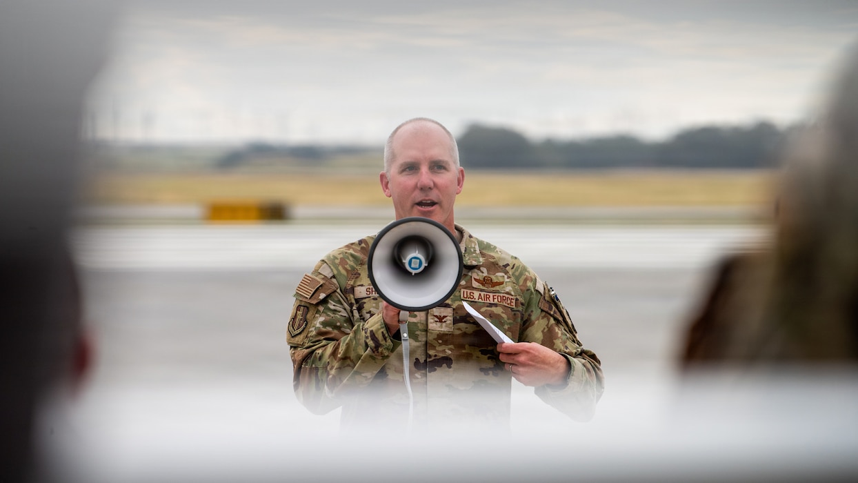 Wing commander delivers remarks during ribbon cutting ceremony