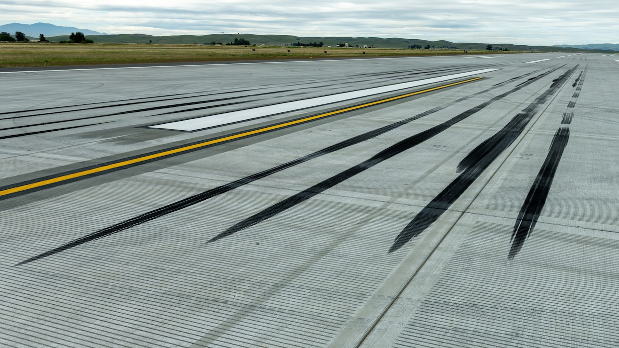 Tire marks are shown on newly opened runway
