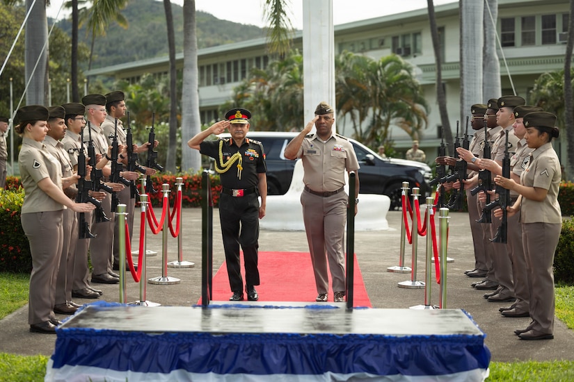 U.S. Army Gen. Ronald P. Clark, United States Army Pacific Commanding general, and Indian Army, Gen. Upendra Dwivedi, Chief of the Army Staff, march up to the podium during the honor ceremony at the historic Palm circle, Fort Shafter, Hawaii, April 20, 2026.