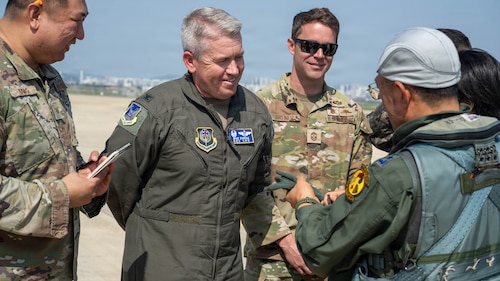 U.S. Air Force Col. Brad Dvorak, left, 31st Air Expeditionary Wing commander and Chief Master Sgt. Matthew Greiner, right, 31 AEW command chief, speak with South Korea air force Lt. Gen. Jun Sun Cha, South Korea air force Operations Command commander.
