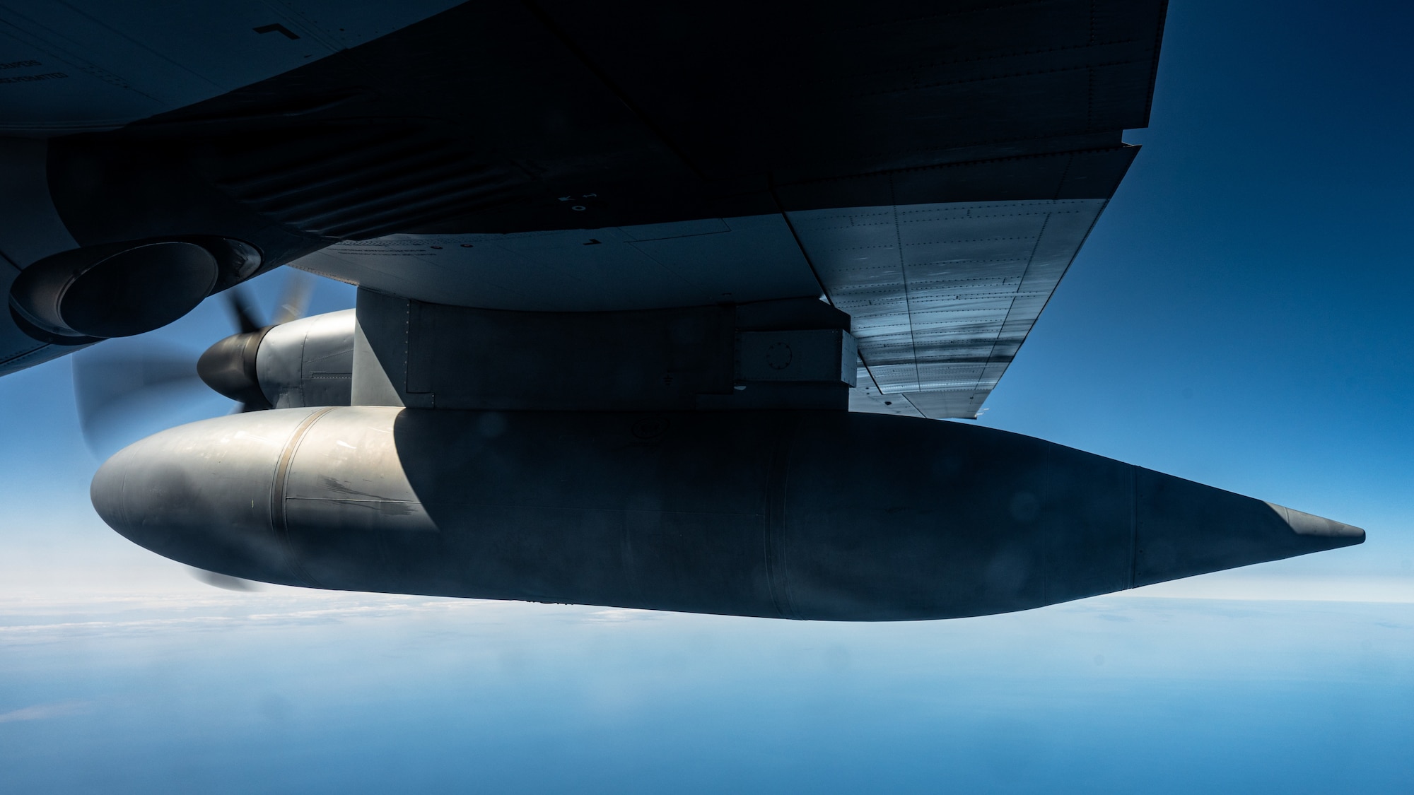 A U.S. Air Force C-130J Super Hercules aircraft equipped with external fuel tanks assigned to the 40th Airlift Squadron flies past the International Date Line near Eareckson Air Station, Alaska, en route to the Philippines during a Maximum Endurance Operation in support of Exercise Balikatan 2026, April 17, 2026. Balikatan is a longstanding annual exercise between the Armed Forces of the Philippines and U.S. military designed to strengthen our ironclad alliance, improve our capable combined force, and demonstrate our commitment to regional security and stability. (U.S. Air Force photo by Senior Airman Jade M. Caldwell)