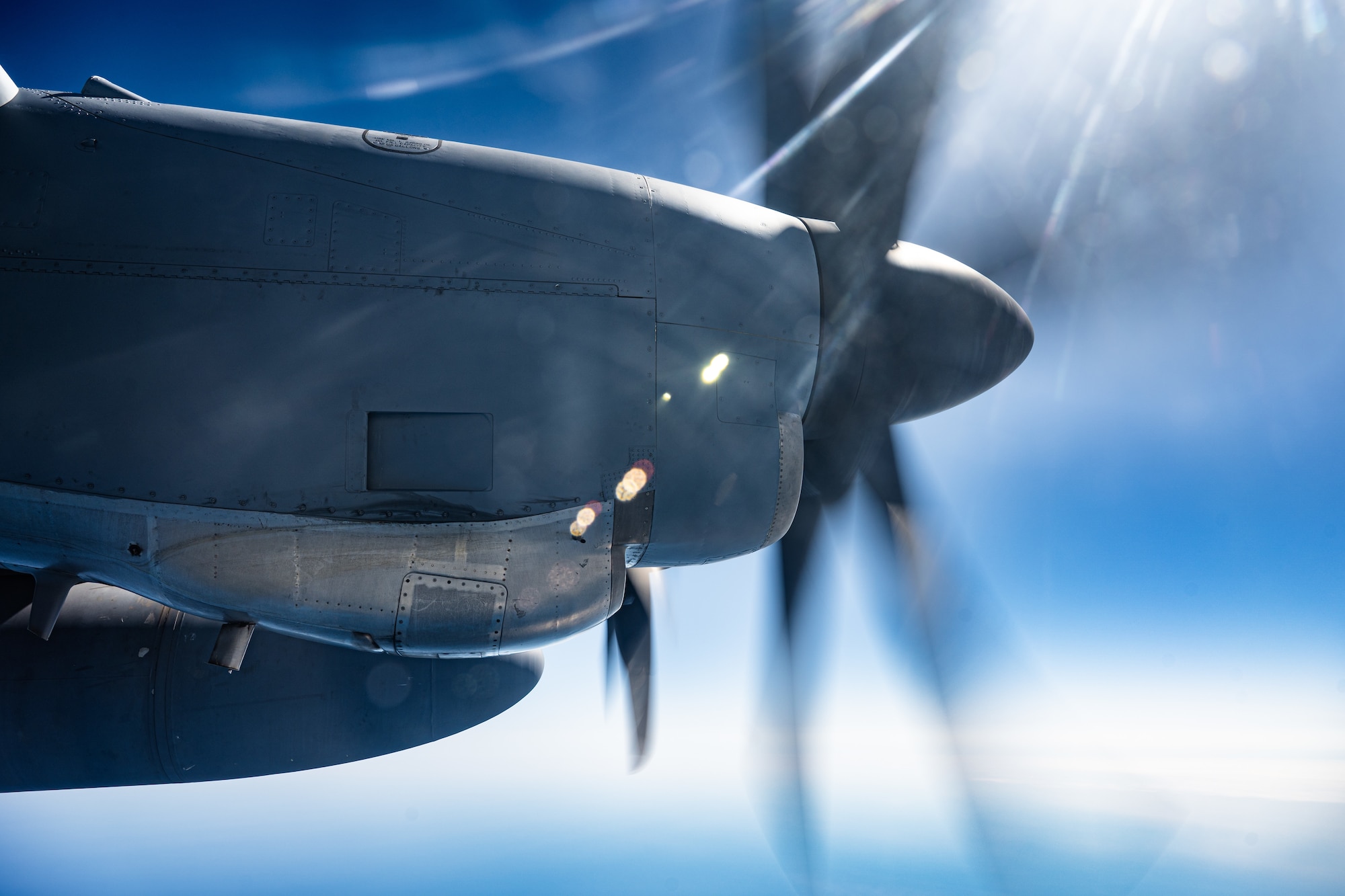 A U.S. Air Force C-130J Super Hercules aircraft equipped with external fuel tanks assigned to the 40th Airlift Squadron flies past the International Date Line near Eareckson Air Station, Alaska, en route to the Philippines during a Maximum Endurance Operation in support of Exercise Balikatan 2026, April 17, 2026. Balikatan is a longstanding annual exercise between the Armed Forces of the Philippines and U.S. military designed to strengthen our ironclad alliance, improve our capable combined force, and demonstrate our commitment to regional security and stability. (U.S. Air Force photo by Senior Airman Jade M. Caldwell)